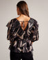 JASMYNA-Tops-Ruffled to perfection and finished with a bow, JASMYNA is your ticket to style heaven. Bottomless brunch? More like your own personal catwalk.The fabric of this product is made of 100% recycled polyester. Using recycled polyester helps divert plastic waste from ending in landfills and helps us to reduce our dependancy on virgin materials. Ruffled top V-neck Abstract print Short sleeved Low back with tie fastening and zip Amy is 5'9.5" / 1.77m and wears Black in a Ted size 1- Ted Baker Romania